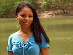 Free Stock Photo: A beautiful African American teen girl posing by a lake