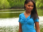 Free Stock Photo: A beautiful African American teen girl posing by a lake