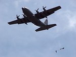 Free Stock Photo: Soldiers parachuting from a C-130 military plane