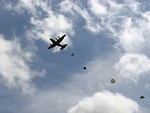 Free Stock Photo: Soldiers parachuting from a C-130 military plane