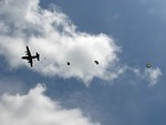 Free Stock Photo: Soldiers parachuting from a C-130 military plane
