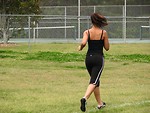 Free Stock Photo: A beautiful teen African American girl running by a tennis court