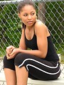 Free Stock Photo: A beautiful teen African American girl sitting on bleachers