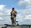 Free Stock Photo: A female soldier on top of a humvee at the 2009 Robins AFB Air Show.