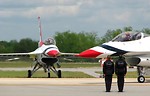 Free Stock Photo: F-16 Air Force Thunderbird jets with crew members on a runway at the 2009 Robins AFB Air Show.