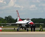 Free Stock Photo: An F-16 Air Force Thunderbird jet with crew members on a runway at the 2009 Robins AFB Air Show.