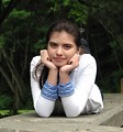 Free Stock Photo: A young girl posing on a stone wall