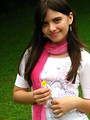 Free Stock Photo: A beautiful young punk rock girl holding a yellow flower