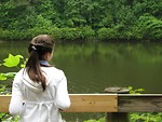 Free Stock Photo: A young girl looking out over a lake