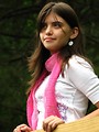 Free Stock Photo: A beautiful young punk rock girl looking over a wooden fence