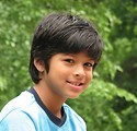 Free Stock Photo: Close-up of a young latino boy posing by the woods