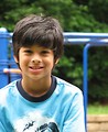 Free Stock Photo: A young latino boy posing by a playground