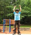 Free Stock Photo: A young latino boy posing by a playground
