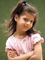 Free Stock Photo: A cute young latina girl posing by a lake