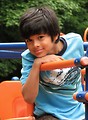 Free Stock Photo: A young latino boy posing on a playground