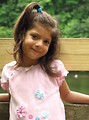 Free Stock Photo: A cute young latina girl posing by a lake