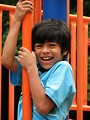 Free Stock Photo: A young latino boy playing on a playground