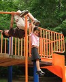 Free Stock Photo: A cute young latina girl and boy playing on a playground