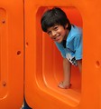 Free Stock Photo: A young latino boy posing on a playground