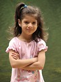 Free Stock Photo: A cute young latina girl posing by a lake
