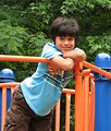 Free Stock Photo: A young latino boy posing on a playground