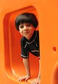Free Stock Photo: A young latino boy playing on a playground