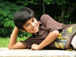 Free Stock Photo: A young latino boy posing outdoors.