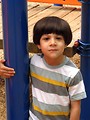 Free Stock Photo: A young latino boy posing on a playground