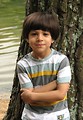 Free Stock Photo: A young latino boy posing by a lake