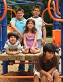 Free Stock Photo: A group of latino kids posing on a playground.