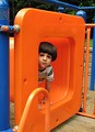 Free Stock Photo: A young latino boy playing on a playground
