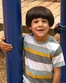 Free Stock Photo: A young latino boy posing on a playground