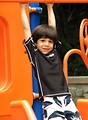 Free Stock Photo: A young latino boy playing on a playground
