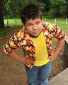 Free Stock Photo: A latino teen boy in a colorful shirt playing outdoors