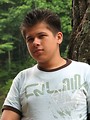 Free Stock Photo: A young latino man posing by a lake
