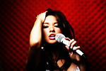 Free Stock Photo: A beautiful woman singing with a microphone