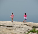 Free Stock Photo: Two young children running on top of Stone Mountain in Atlanta, Georgia