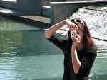 Free Stock Photo: Young woman taking a photograph