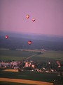 Free Stock Photo: Hot air balloons flying over a field