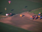Free Stock Photo: Hot air balloons flying over a field