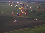Free Stock Photo: Hot air balloons flying over a field