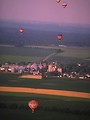 Free Stock Photo: Hot air balloons flying over a field