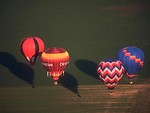 Free Stock Photo: Hot air balloons flying over a field.