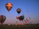 Free Stock Photo: Hot air balloons taking off from a field