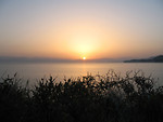 Free Stock Photo: The sun rising over a lake