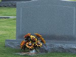 Free Stock Photo: A blank tombstone with flowers