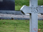Free Stock Photo: A cross shaped tombstone.