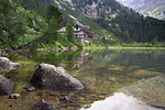 Free Stock Photo: A chalet by a stream at the base of a mountain