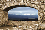 Free Stock Photo: A mountain view through a stone arch