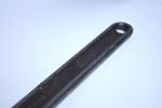 Free Stock Photo: Handle of an adjustable wrench isolated on a white background